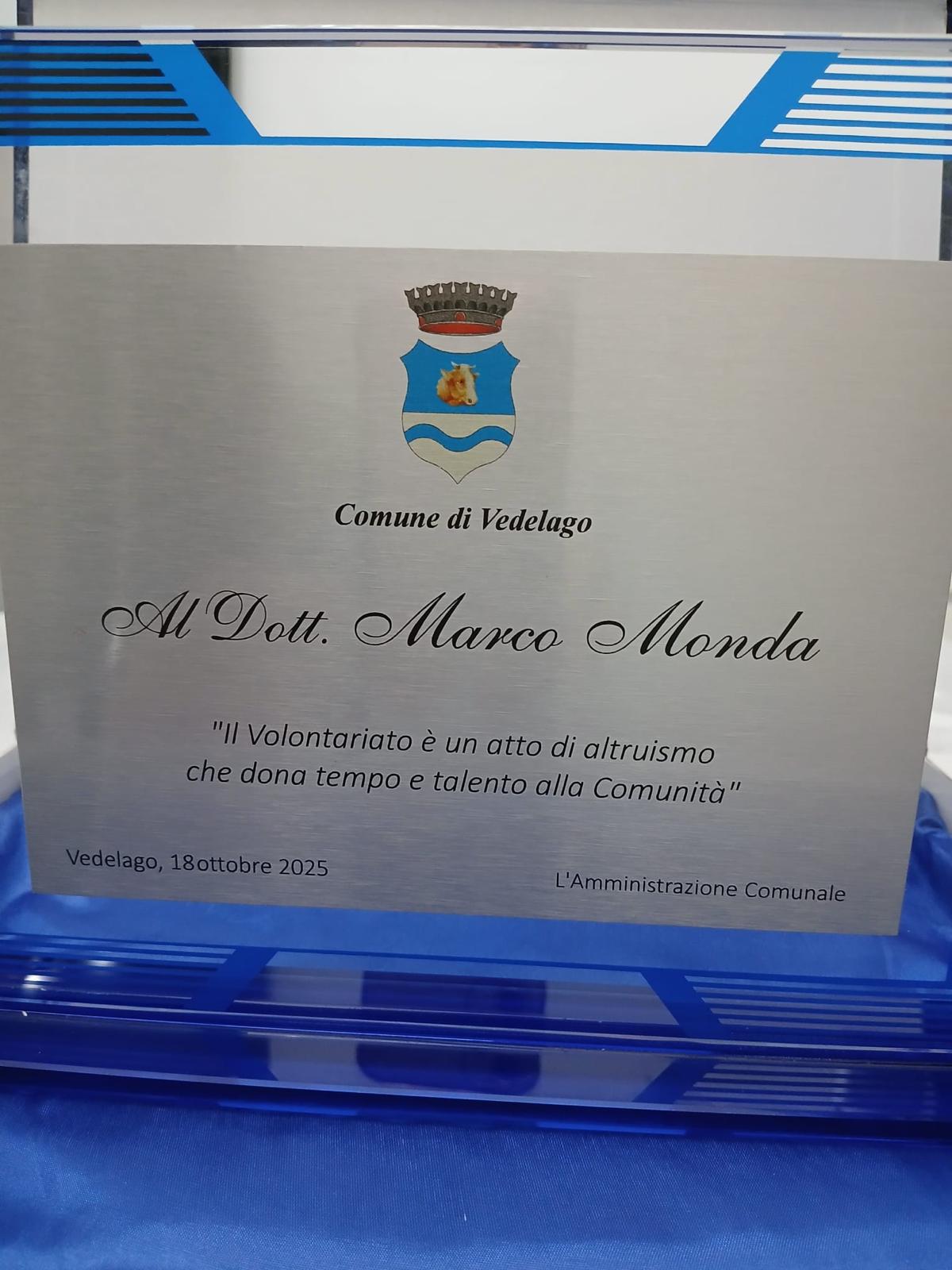 Targa del Comune di Vedelago dedicata al Dott. Marco Monda per il volontariato